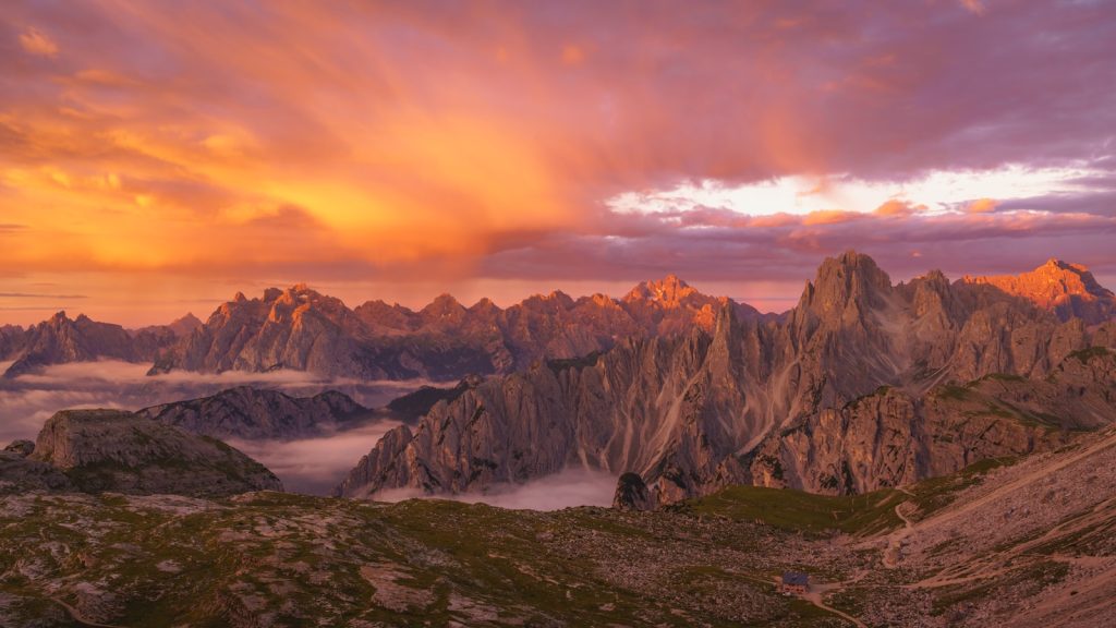 a view of a mountain range at sunset