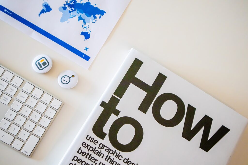 a book with a keyboard and mouse on a table